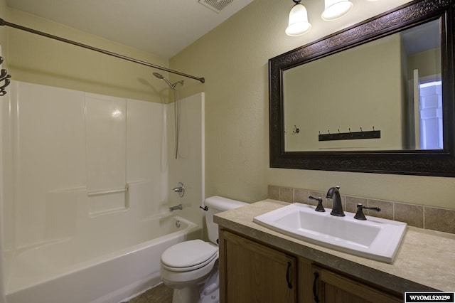 full bathroom featuring bathing tub / shower combination, vanity, and toilet