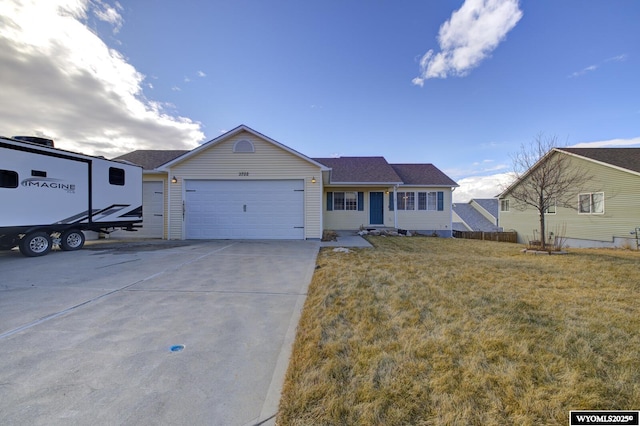 view of front facade with a garage and a front lawn