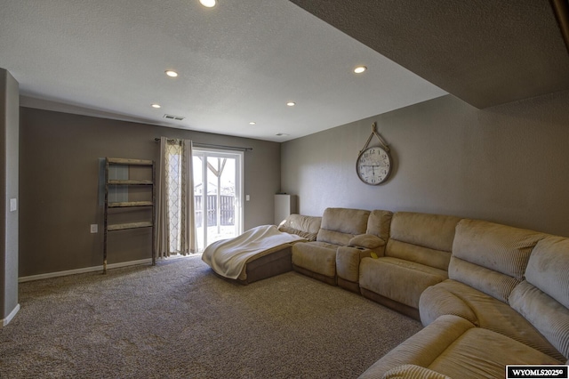 carpeted living room with a textured ceiling