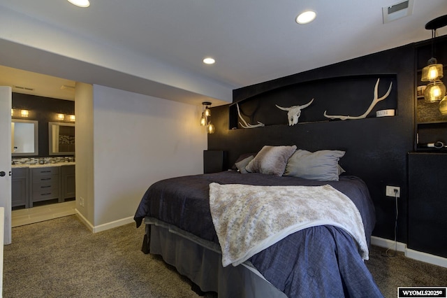 carpeted bedroom featuring ensuite bathroom