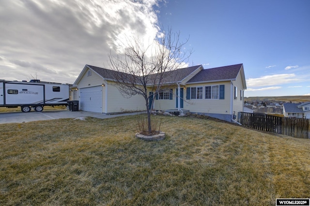 view of front of home with a garage and a front lawn