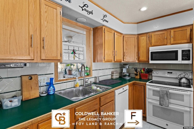 kitchen with sink, white appliances, tasteful backsplash, ornamental molding, and a textured ceiling