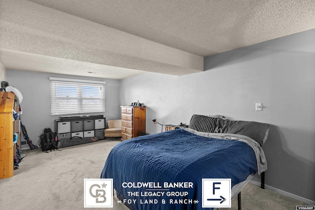 carpeted bedroom with a textured ceiling