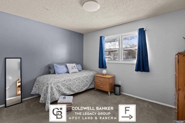 bedroom with carpet and a textured ceiling