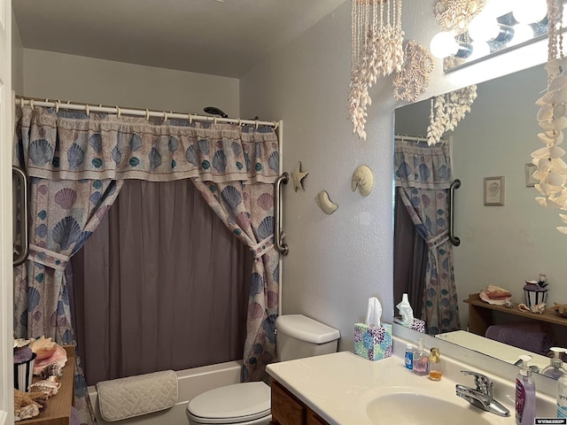 full bathroom with shower / tub combo with curtain, vanity, and toilet