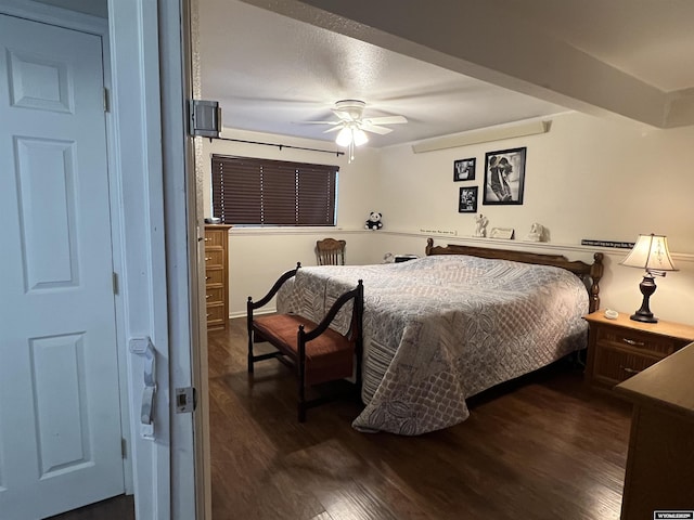 bedroom featuring ceiling fan and dark hardwood / wood-style flooring