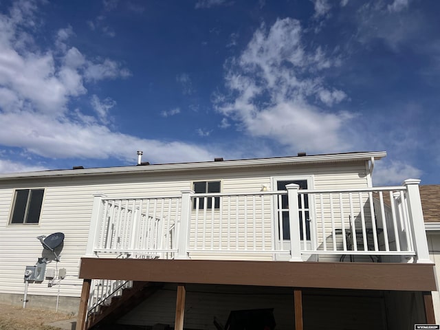 rear view of house featuring a deck