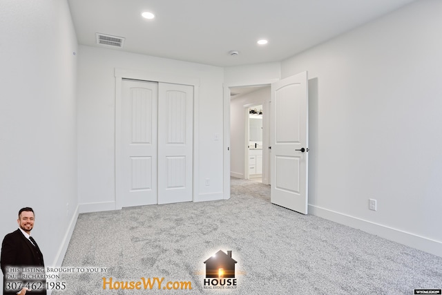 unfurnished bedroom featuring baseboards, recessed lighting, visible vents, and light colored carpet