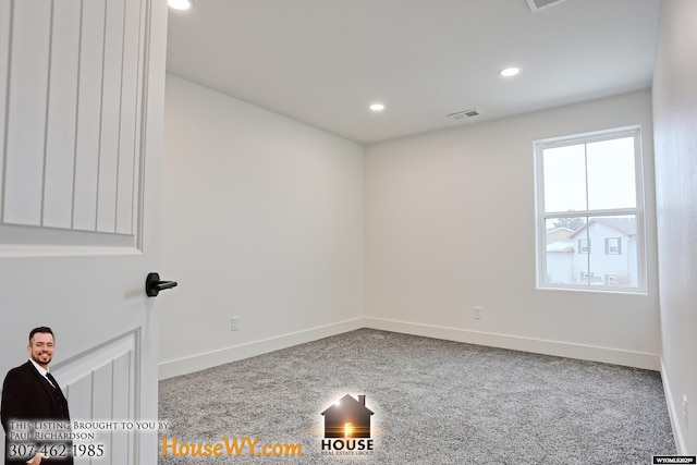 carpeted empty room featuring baseboards, visible vents, and recessed lighting