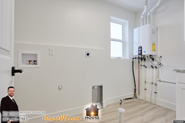 washroom with laundry area, light wood-style flooring, hookup for a washing machine, water heater, and electric dryer hookup