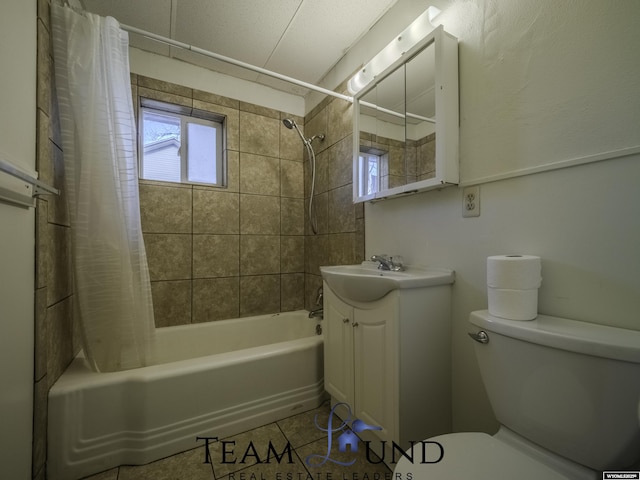 full bathroom featuring tile patterned floors, toilet, shower / bath combo with shower curtain, and vanity