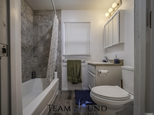 full bathroom featuring vanity, hardwood / wood-style flooring, shower / bath combination with curtain, and toilet