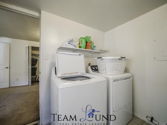 laundry room featuring electric panel, carpet, and washer and dryer