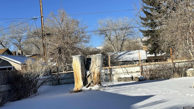 view of yard layered in snow