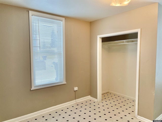 unfurnished bedroom with a closet