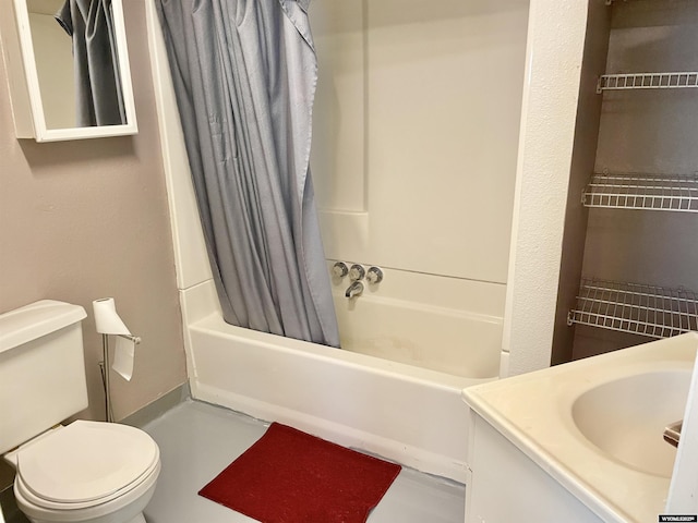 full bathroom featuring vanity, shower / bath combo with shower curtain, and toilet