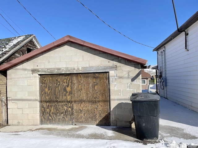 view of snow covered garage