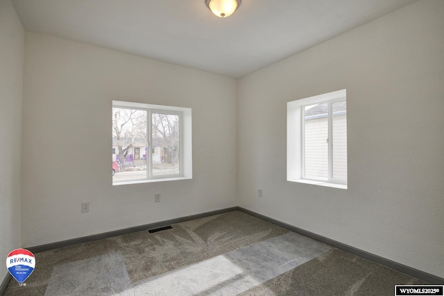 spare room featuring carpet