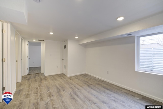 basement featuring light hardwood / wood-style flooring