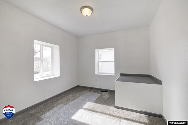 view of carpeted spare room