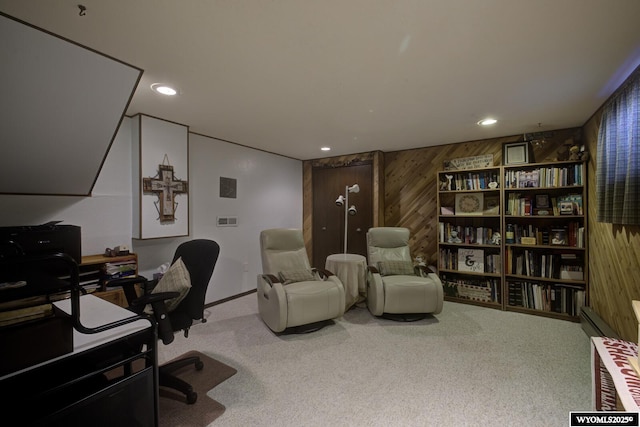 carpeted office space with recessed lighting and wooden walls