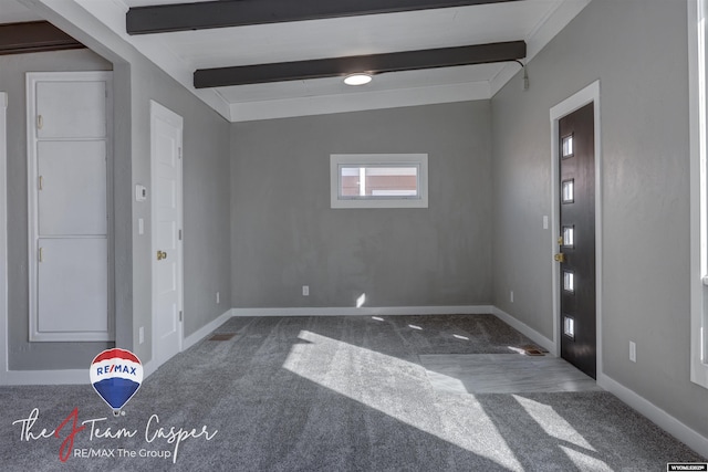 foyer featuring lofted ceiling with beams and carpet floors