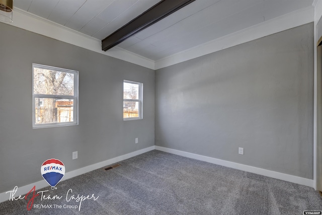 carpeted spare room featuring crown molding and beamed ceiling