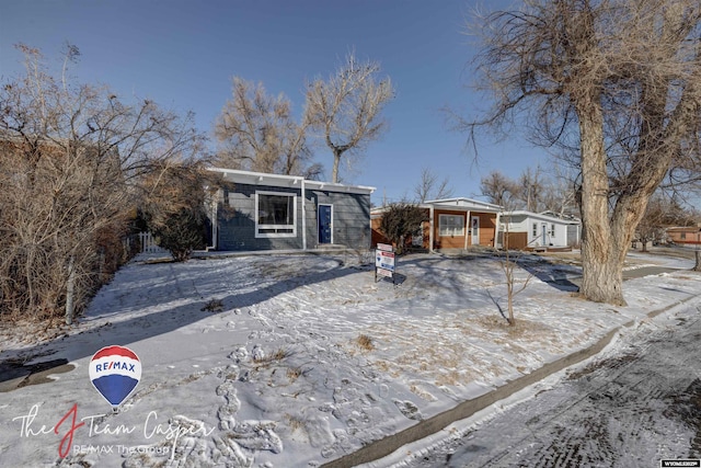 single story home with covered porch