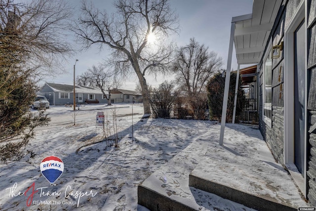 view of yard covered in snow