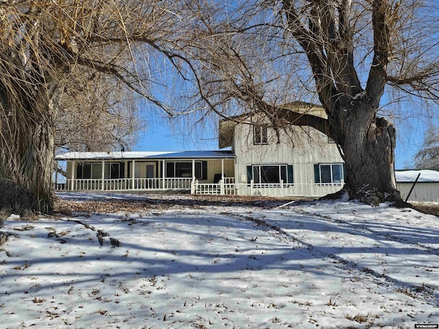 view of front of house with a sunroom