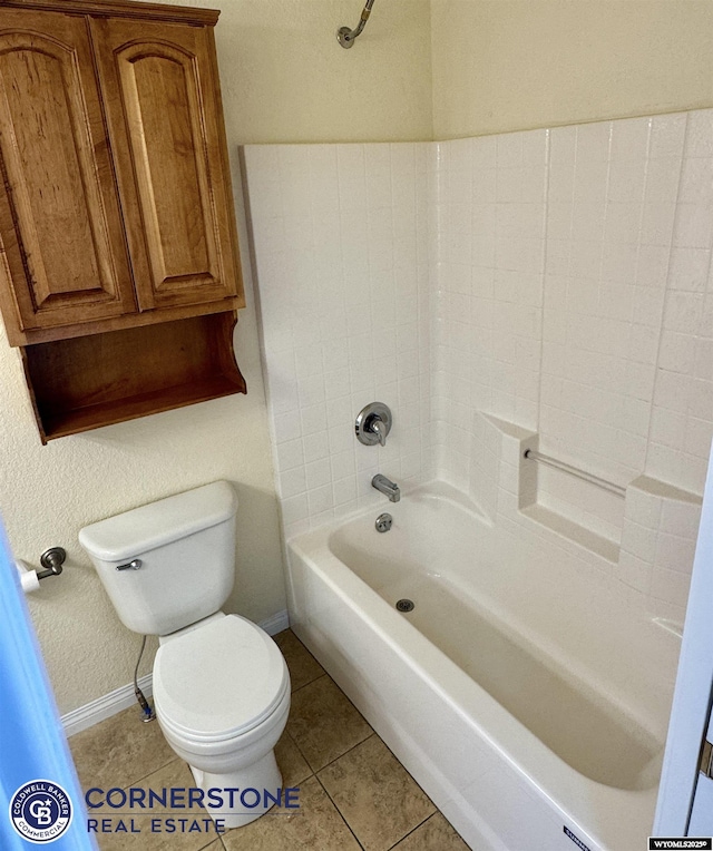 bathroom featuring tile patterned flooring, shower / bathing tub combination, and toilet