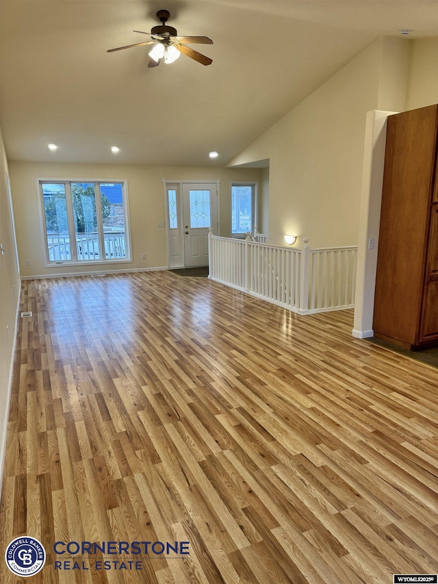 unfurnished living room with lofted ceiling, light hardwood / wood-style flooring, and ceiling fan