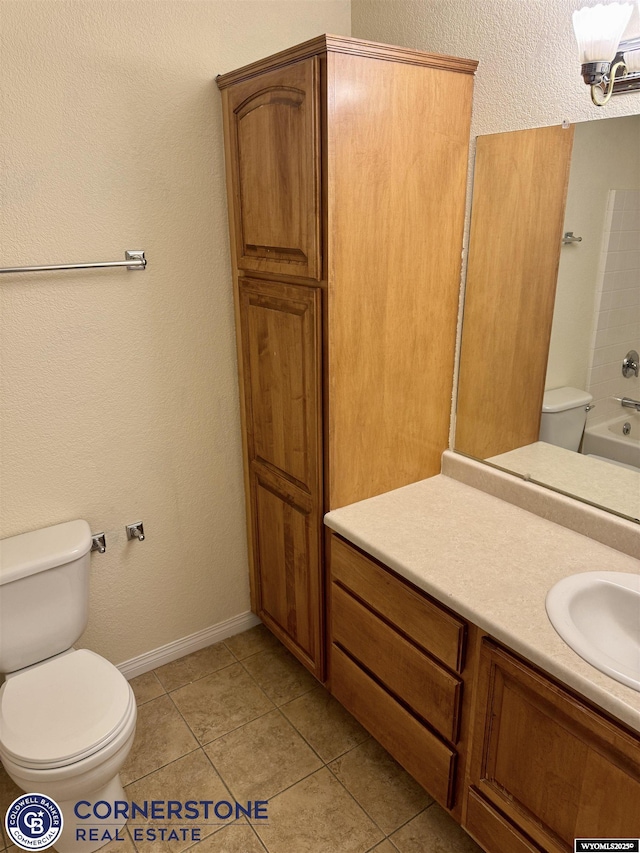 full bathroom with vanity, toilet, tile patterned flooring, and shower / bathing tub combination