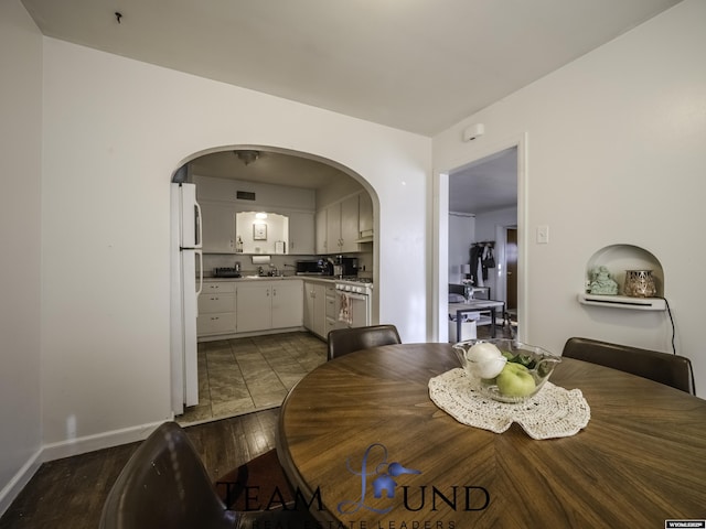 dining room with dark hardwood / wood-style floors