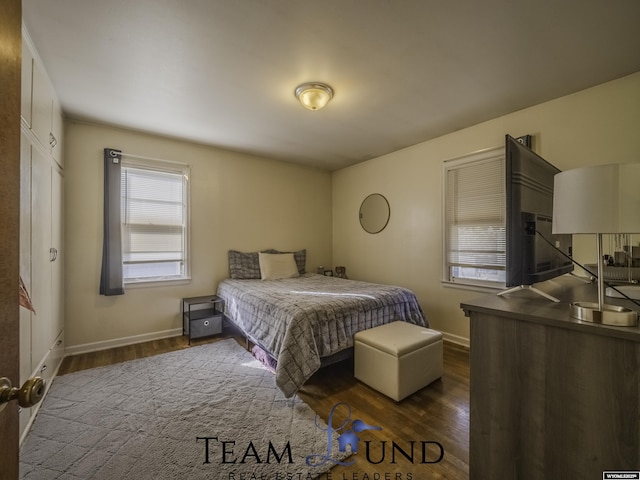 bedroom featuring dark hardwood / wood-style flooring