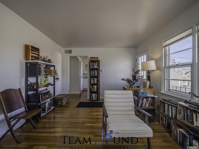 living area with dark wood-type flooring