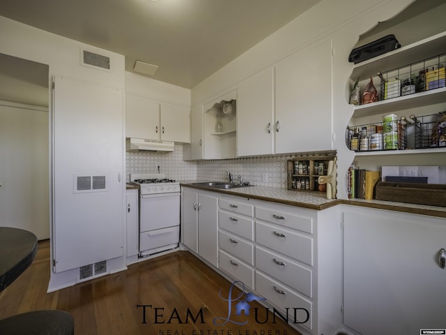 kitchen featuring white cabinetry, sink, white range with gas stovetop, and dark hardwood / wood-style flooring