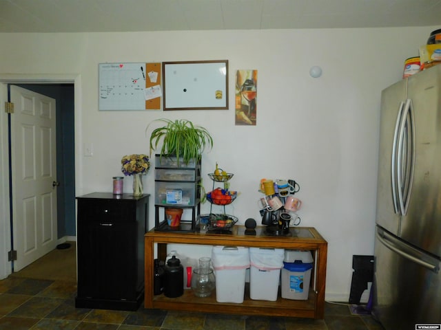 interior space featuring stainless steel fridge