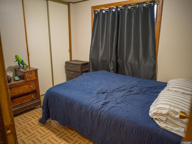 bedroom featuring light parquet floors