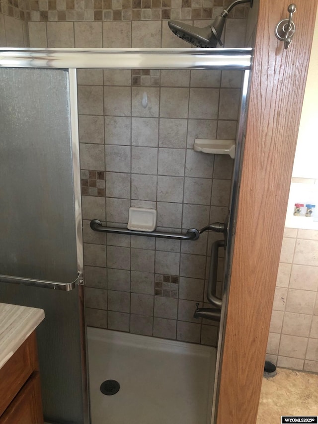 bathroom with a shower stall