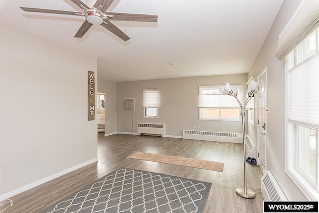 interior space with radiator and dark hardwood / wood-style floors