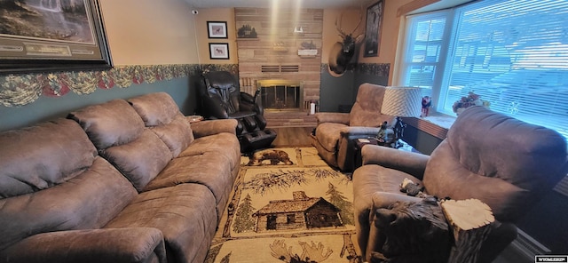 living room featuring a fireplace and wood finished floors