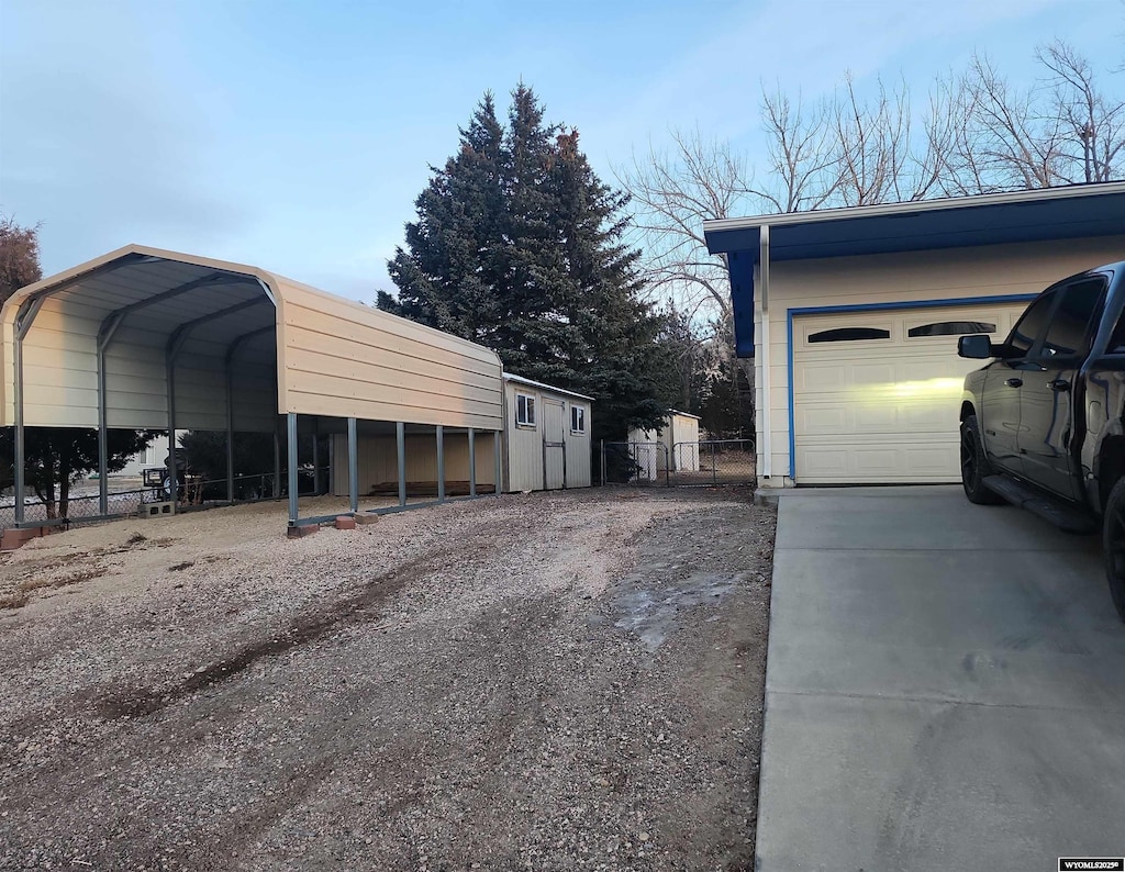 view of side of property with a carport