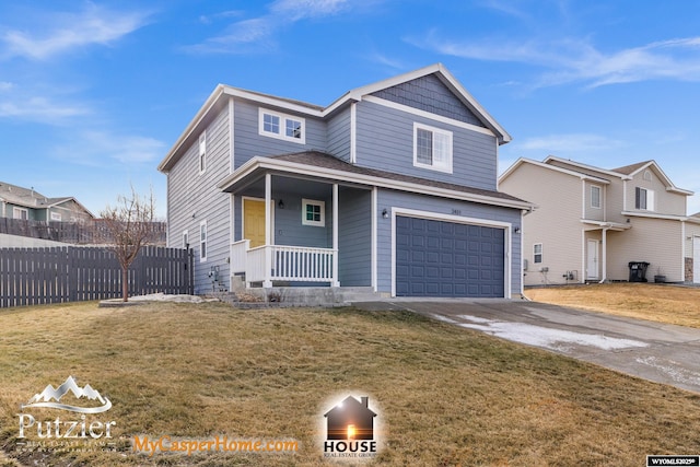 view of front of house with a garage and a front yard