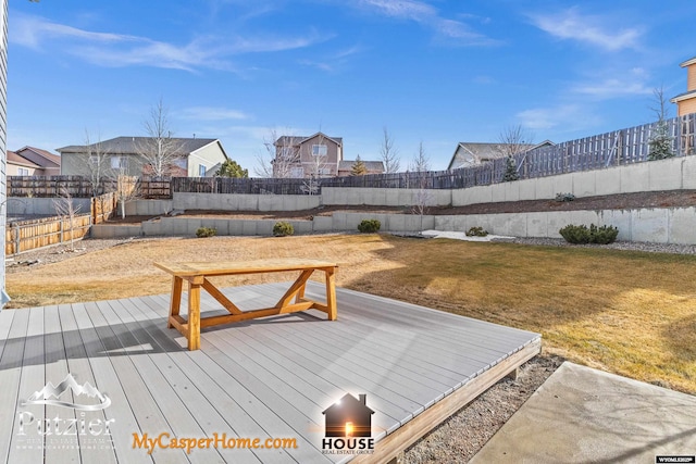 wooden deck featuring a yard