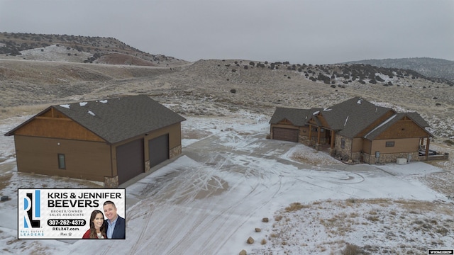 birds eye view of property with a mountain view