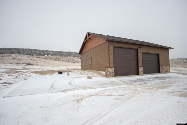 view of snow covered garage