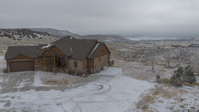 view of front of house featuring a mountain view and a garage