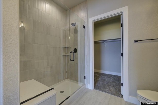 bathroom with a shower with shower door