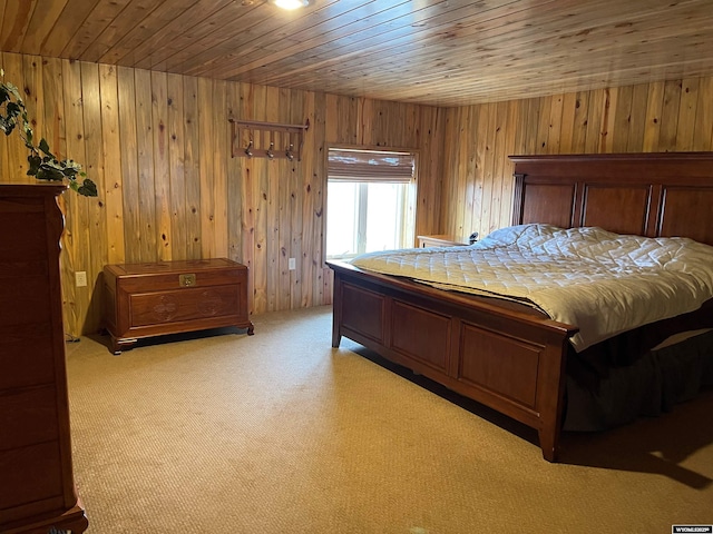 carpeted bedroom featuring wooden walls and wooden ceiling